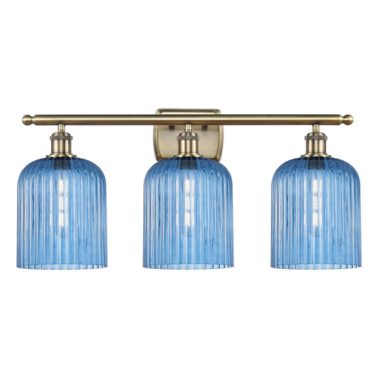 Innovations Bridal Veil 25in 3-Light Bath Vanity | Art Nouveau Antique Brass Steel and Princess Blue Ribbed Glass | Bathroom | Model 516-3W-AB-G559-8BL