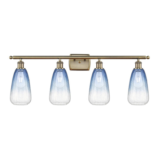 Innovations Brookhaven Almond 36in 4-Light Bath Vanity Light | Industrial Antique Brass and Sapphire Blue Glass | Bathroom | Model 516-4W-AB-G480-6SB