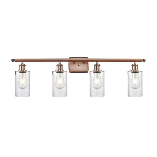 Innovations Clymer 34in 4-Light Bath Vanity Light | Art Nouveau Antique Copper Steel and Seedy Glass | Bathroom Vanity | 33.88 x | Model 516-4W-AC-G804