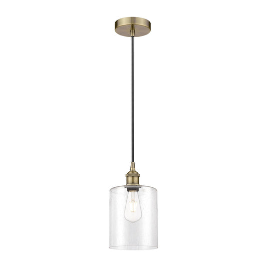 Innovations Paladin 7in 1-Light Mini Pendant | Farmhouse Antique Brass Steel and Seedy Glass Cylinder | Kitchen Island & Dining | Model 616-1P-AB-G4424-7