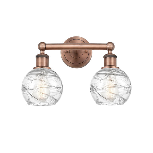 Innovations Athens Deco Swirl 15in 2-Light Bath Vanity Light | Industrial Antique Copper and Clear Glass | Damp Rated Bathroom | Model 616-2W-AC-G1213-6CL