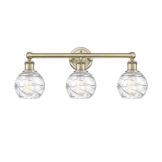 Innovations Athens Deco Swirl 24in 3-Light Bath Vanity | Industrial Antique Brass Steel and Clear Deco Swirl Glass | Bathroom | Model 616-3W-AB-G1213-6CL
