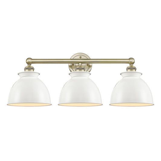 Innovations Adirondack 26in 3-Light Bath Vanity | Industrial Farmhouse Antique Brass and Glossy White Metal Shade | Damp-Rated | Model 616-3W-AB-M14-W