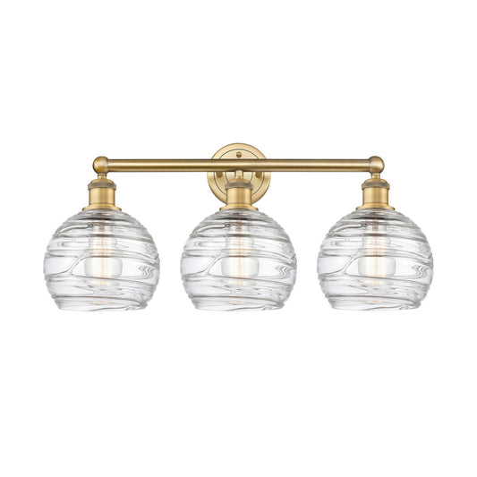 Innovations Athens Deco Swirl 26in 3-Light Bath Vanity | Industrial Brushed Brass Steel and Clear Deco Swirl Glass | Bathroom | Model 616-3W-BB-G1213-8CL