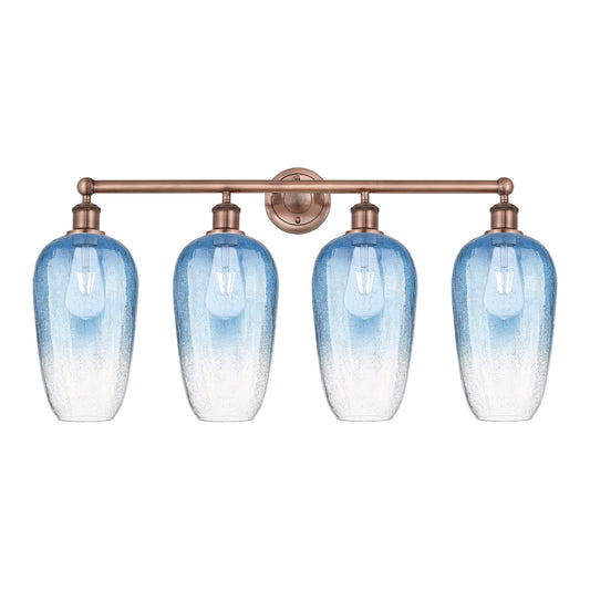 Innovations Brookhaven Flute 34in 4-Light Bath Vanity Light | Industrial Antique Copper and Sapphire Blue Glass | Bathroom | Model 616-4W-AC-G484-7SB