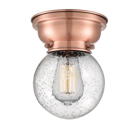 Innovations Beacon 6in 1-Light Flush Mount | Industrial Antique Copper Steel and Seedy Glass | Bedroom & Hallway | 600 Lumens | Model 623-1F-AC-G204-6-LED