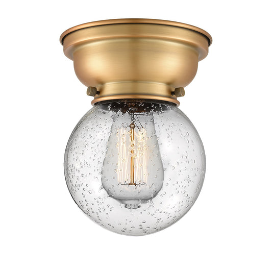 Innovations Beacon 6in 1-Light Flush Mount | Industrial Brushed Brass Steel and Seedy Glass | Entryway & Hallway | 6 x 6 x 8.38 in | Model 623-1F-BB-G204-6