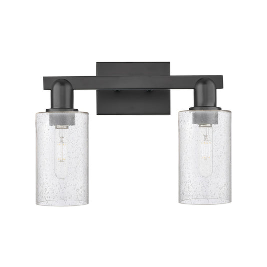 Innovations Clymer 15in 2-Light Bath Vanity Light | Industrial Matte Black Steel and Seedy Glass | Bathroom Vanity | 14.88 x 10.62 | Model 716-2W-BK-G804
