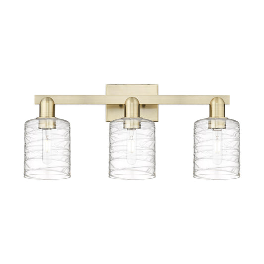 Innovations Cobbleskill 24in 3-Light Bath Vanity Light | Industrial Antique Brass and Deco Swirl Clear Glass | Bathroom Vanity | Model 716-3W-AB-G1113