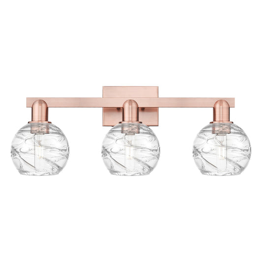 Innovations Athens Deco Swirl 26in 3-Light Bath Vanity Light | Industrial Antique Copper Steel and Clear Glass | Bathroom | Model 716-3W-AC-G1213-6CL
