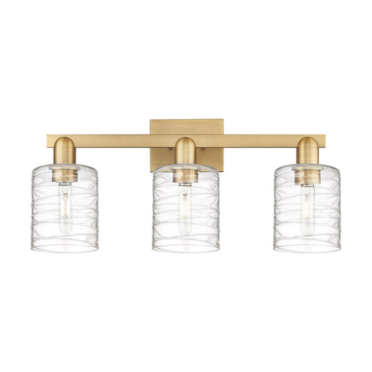 Innovations Cobbleskill 24in 3-Light Bath Vanity Light | Industrial Brushed Brass Steel and Deco Swirl Clear Glass | Bathroom | Model 716-3W-BB-G1113