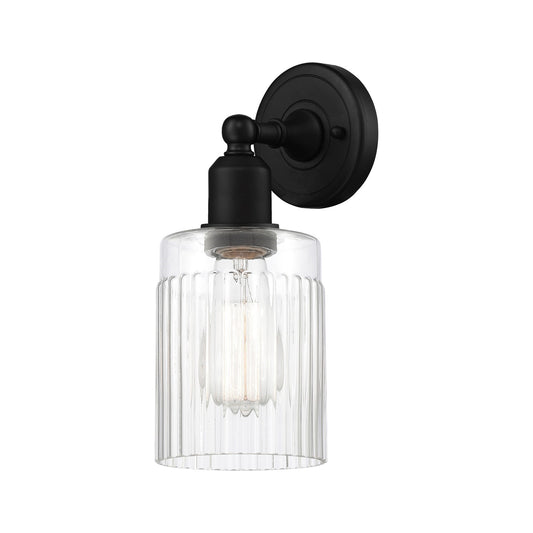 Innovations Hadley 1-Light 4.5in Wall Sconce | Industrial Matte Black Steel and Clear Ribbed Glass | Damp Rated Hallway & Bathroom | Model 900-1W-BK-G342