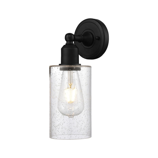 Innovations Clymer 1-Light 4in Wall Sconce | Industrial Matte Black Steel and Cast Brass with Seedy Glass Shade | Bedroom & Hallway | Model 900-1W-BK-G804