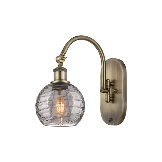 Innovations Athens Deco Swirl 6in 1-Light Wall Sconce | Industrial Antique Brass and Light Smoke Deco Swirl Glass | Bedroom & | Model 918-1W-AB-G1213-6SM