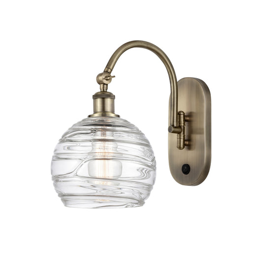 Innovations Athens Deco Swirl 8in 1-Light Wall Sconce | Industrial Antique Brass and Clear Deco Swirl Glass | Bedroom & | Model 918-1W-AB-G1213-8CL
