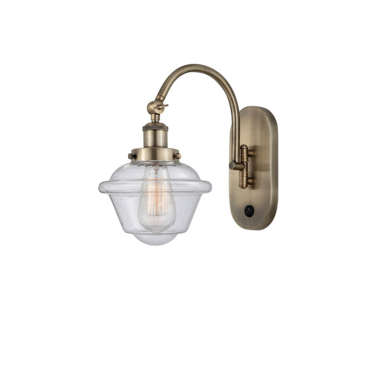Innovations Oxford 7.5in 1-Light LED Swing Arm Wall Sconce | Traditional Antique Brass Steel and Seedy Glass Shade | Bedroom & | Model 918-1W-AB-G534-LED