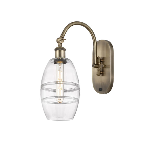 Innovations Vaz 6in 1-Light Wall Sconce | Industrial Antique Brass and Clear Glass | Bedroom & Hallway Accent | 5.88 x 12.12 in | Model 918-1W-AB-G557-6CL