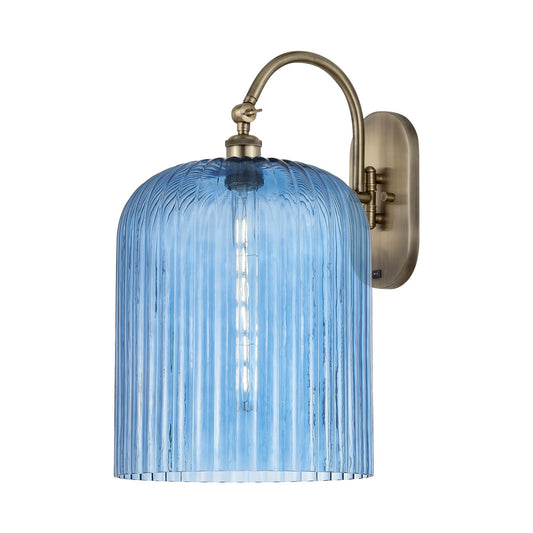 Innovations Bridal Veil 12in 1-Light Wall Sconce | Industrial Antique Brass and Princess Blue Glass | Hallway & Bathroom | Model 918-1W-AB-G559-12BL