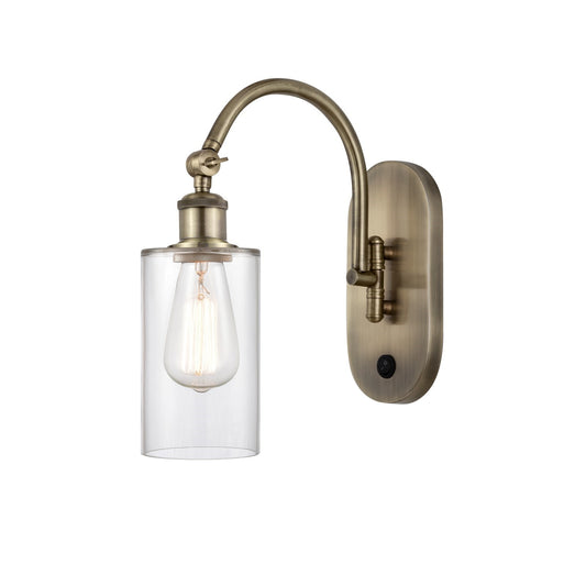 Innovations Clymer 4in 1-Light Wall Sconce | Industrial Antique Brass and Clear Glass | Bedroom & Hallway Accent | 3.88 x 12.88 in | Model 918-1W-AB-G802