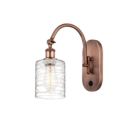 Innovations Cobbleskill 5in 1-Light Wall Sconce | Industrial Antique Copper Steel and Deco Swirl Glass | Hallway & Bathroom Accent | Model 918-1W-AC-G1113