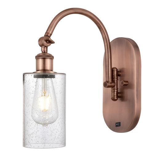 Innovations Clymer 4in 1-Light Wall Sconce | Industrial Antique Copper Steel and Seedy Glass | Bedroom & Hallway Accent Light | Model 918-1W-AC-G804