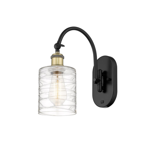 Innovations Cobbleskill 5in 1-Light Wall Sconce | Industrial Black Antique Brass and Deco Swirl Glass | Bedroom & Hallway Accent | Model 918-1W-BAB-G1113