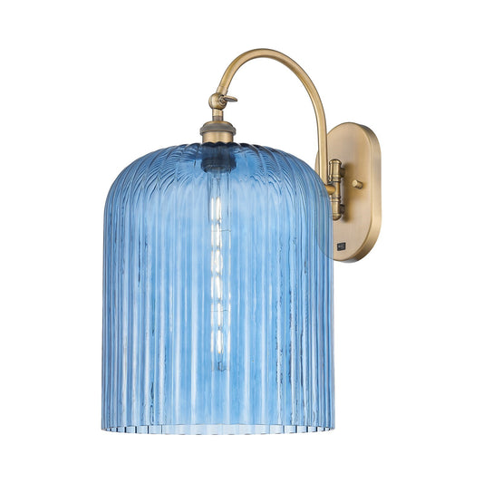 Innovations Bridal Veil 12in 1-Light Wall Sconce | Industrial Brushed Brass and Princess Blue Ribbed Glass | Bedroom & Hallway | Model 918-1W-BB-G559-12BL