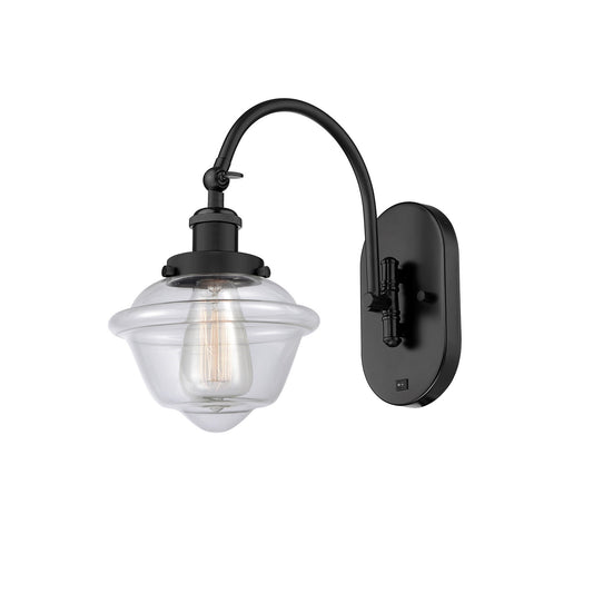 Innovations Oxford 8in 1-Light Swing Arm Wall Sconce | Industrial Matte Black Steel and Clear Glass | Bedroom Reading Light | Model 918-1W-BK-G532-LED