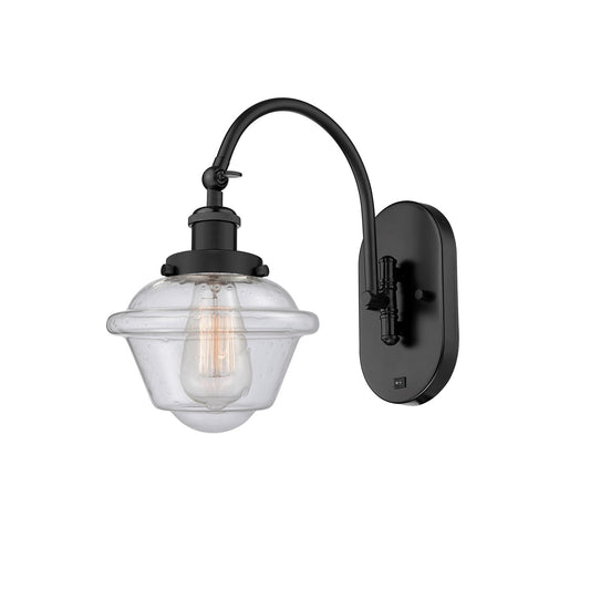 Innovations Oxford 8in 1-Light Swing Arm Wall Sconce | Industrial Matte Black Steel and Seedy Glass | Bedroom Reading Light | Model 918-1W-BK-G534-LED