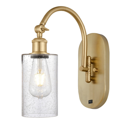 Innovations Clymer 1-Light Wall Sconce | Industrial Satin Gold Steel and Seedy Glass | Bathroom & Hallway Accent | 3.88 x 12.88 in | Model 918-1W-SG-G804