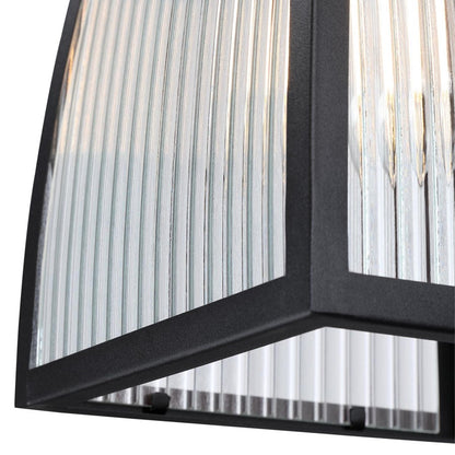 Westinghouse Niko 8in 1-Light Outdoor Sconce | Industrial Textured Black and Clear Ribbed Glass | Entryway & Porch | 8 x 9 x 13 in | Model 6122400